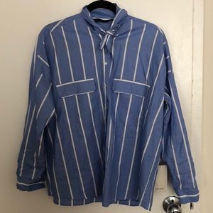 Button down shirt with bow detail.